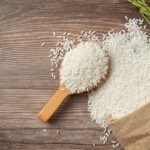 sack-rice-with-rice-wooden-spoon-rice-plant-2048x1365-1